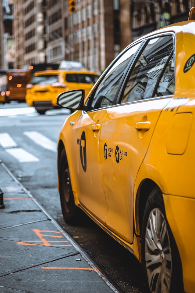 Yellow taxi cab on a city street